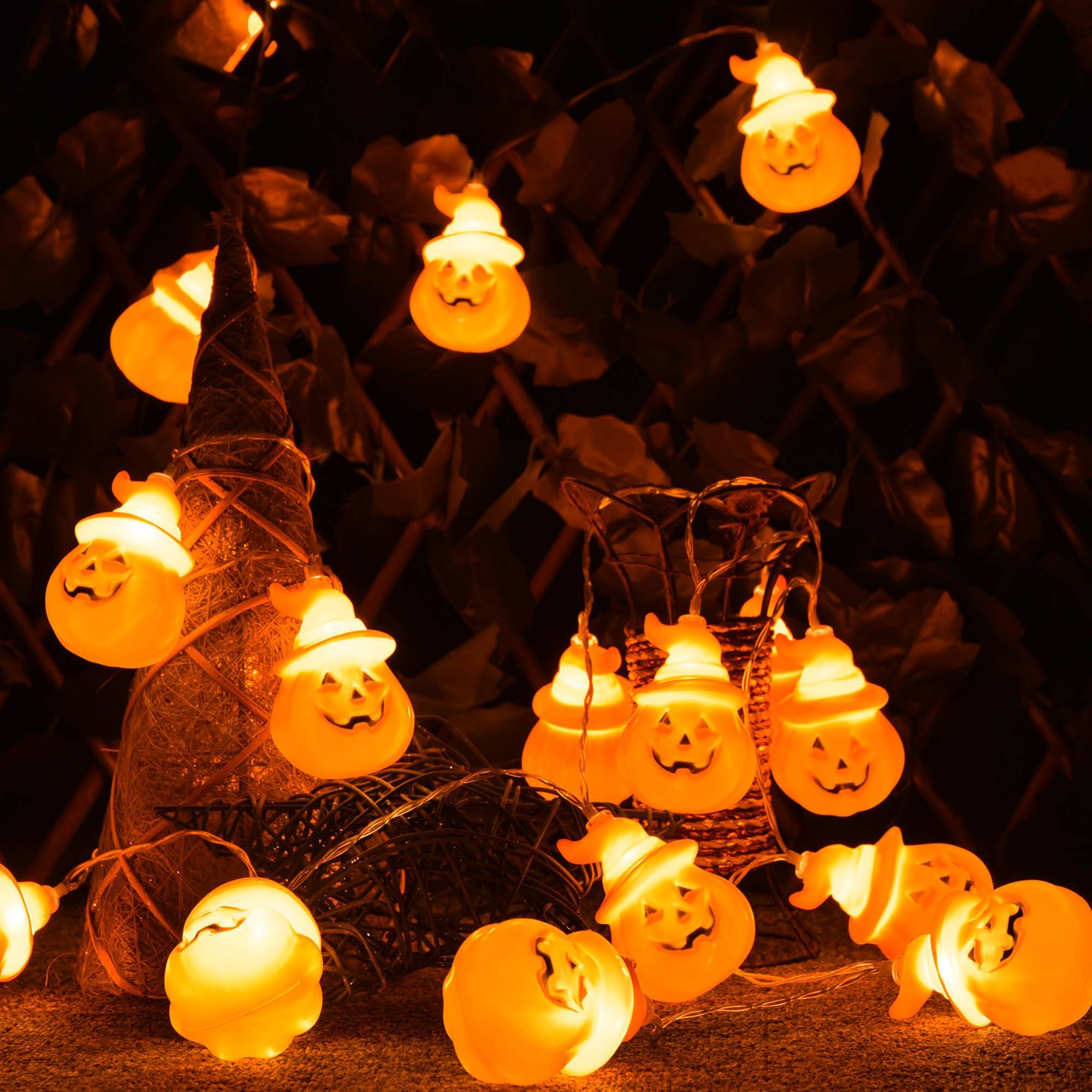 Close-up of battery-powered Halloween string lights with ghost and pumpkin shapes