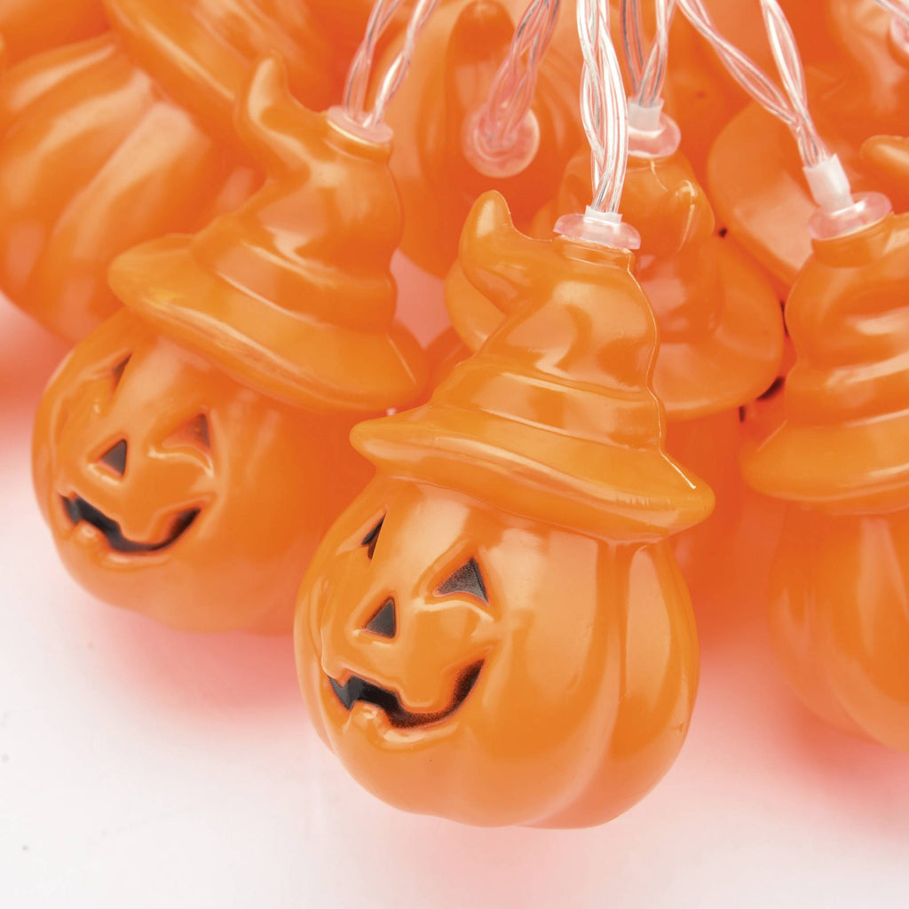 Close-up of battery-powered Halloween string lights with ghost and pumpkin shapes